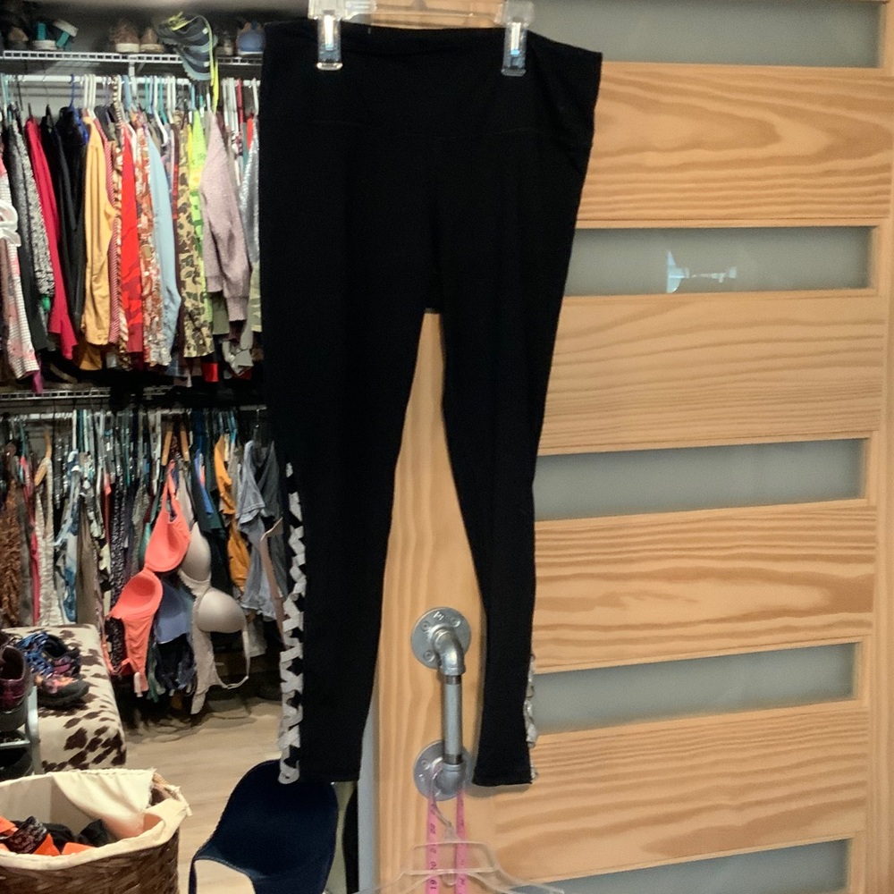 Black Leggings with criss cross leg details.